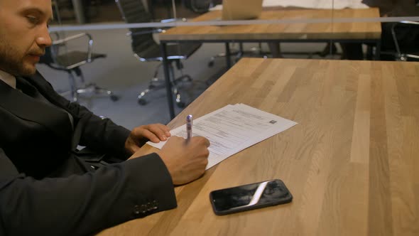 Customer Signing Employment Contract in Office During the Meeting