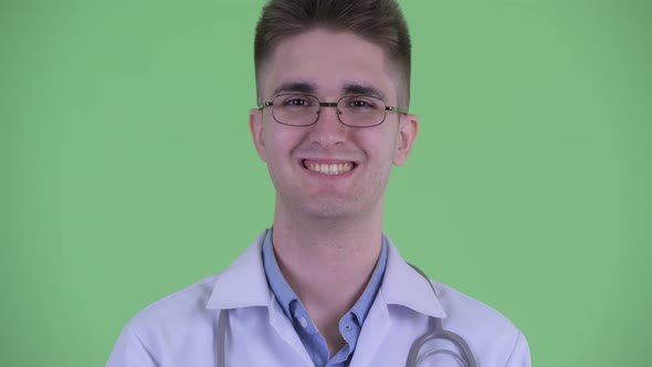 Face of Happy Young Man Doctor Smiling