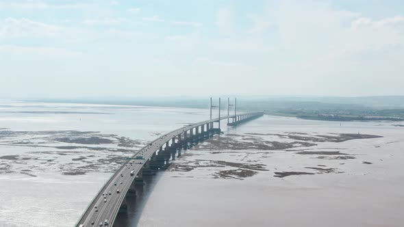 Dolly forward aerial drone shot towards Prince of wales Bridge over Severn Estuary