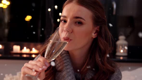Young Woman with Champagne at Home at Night