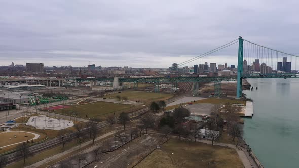 Panning aerial view of the Ambassador Bridge from Detroit