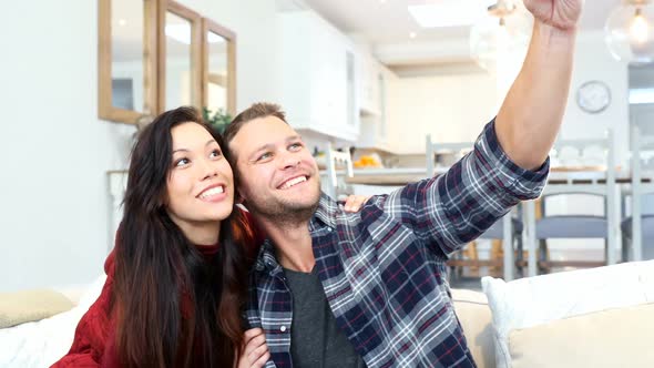 Happy couple taking selfie with mobile phone 4k