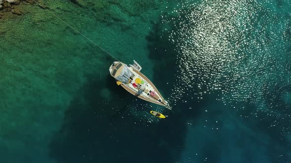 Aerial view of boat anchored on the coast of Varko, Greece.