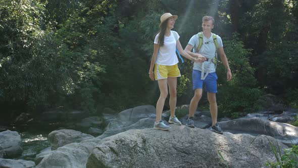 Cheerful Couple of Hikes Enjoying Panaromic View