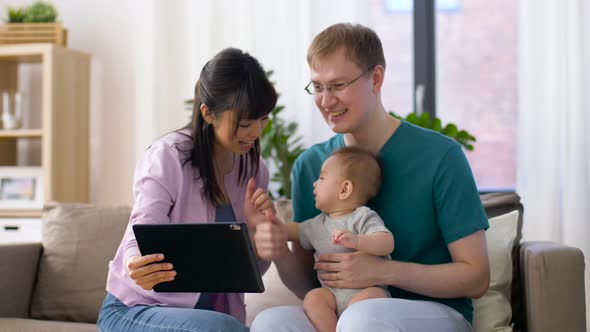 Family with Baby Having Video Call on Tablet Pc 16