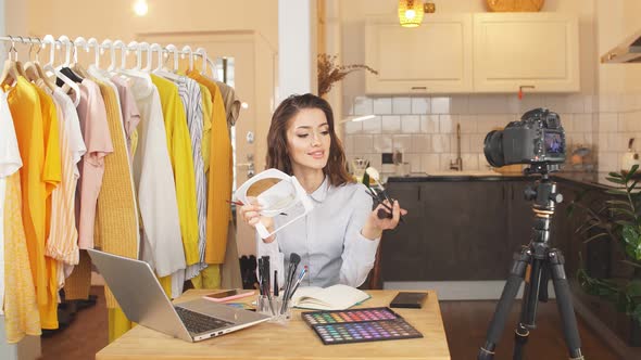 Young Female Blogger Does Makeup on Camera, Shows Her Daily Makeup To Subscribers, Remote Work