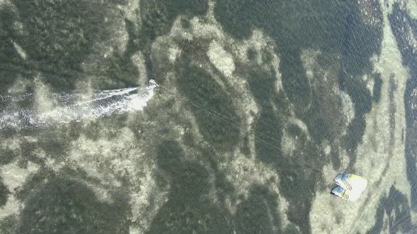 Vertical Video Kitesurfing Near the Shore of Zanzibar Tanzania Aerial View