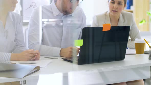 Business Team with Laptop Working at Office