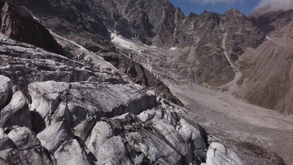 Flight Above Cracks of Mizhirgi Glacier in Caucasus Mountains