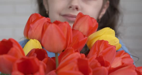 Child with bright tulips