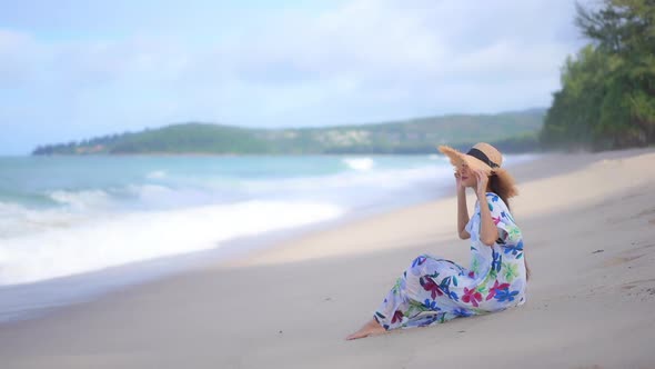 Asian woman enjoy around beautiful beach sea ocean