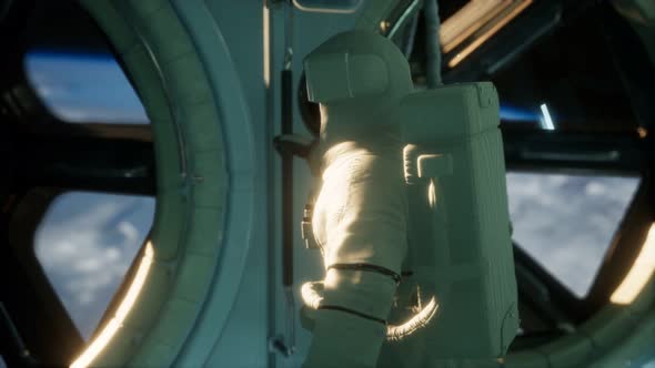 Astronaut Inside the Orbital Space Station alt