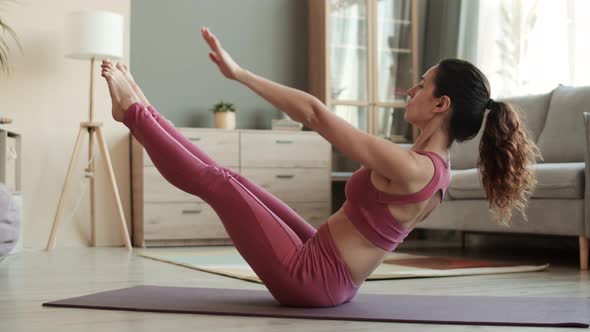 Woman Performing Scissor V-ups