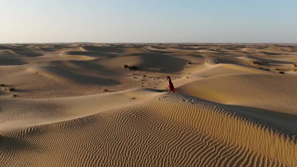 Gorgeous Scenery Rub Al Khali Desert of UAE Woman is Walking on Sand Dunes