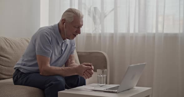 Senior Man Making Video Call to Relatives