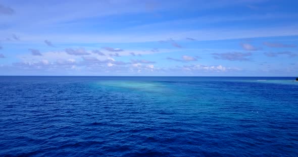 Beautiful fly over copy space shot of a sunshine white sandy paradise beach and aqua turquoise water