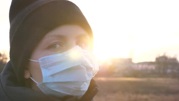 Young Woman Wearing Face Mask Outdoors. 