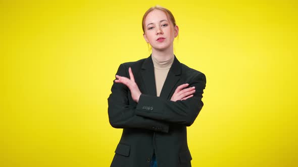 Confident Elegant Caucasian Young Businesswoman Crossing Hands and Looking at Camera