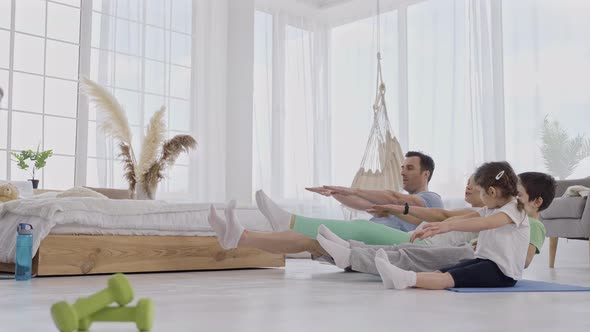 Harmonious Couple with Kids Training Yoga Pose