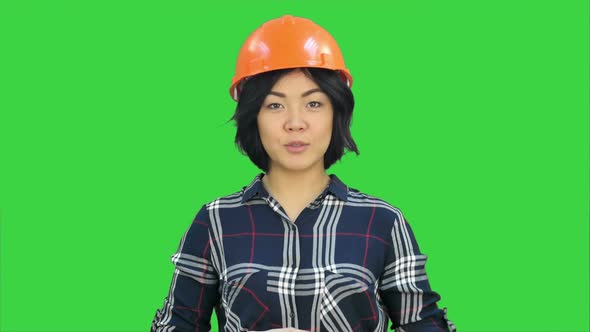 Female Engineer Standing and Talking To a Camera on a Green Screen, Chroma Key