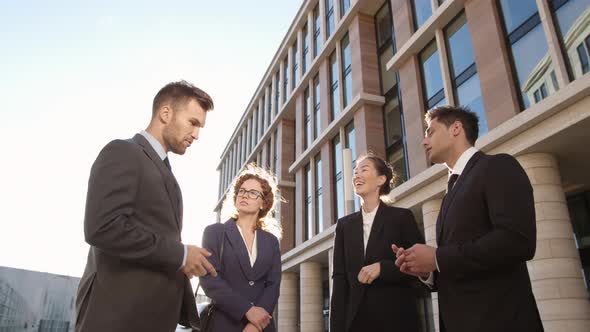 Team of Businesspeople Talking Outdoors