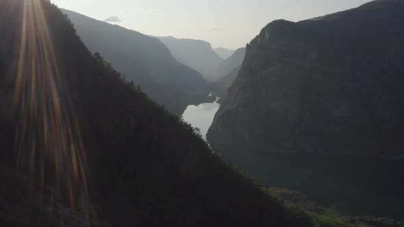 Drone Over Mountains And River At Sunset