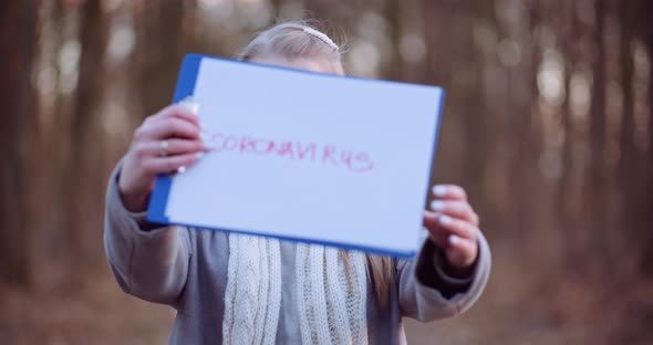 Woman Putting on Protective Mask Against Coronavirus