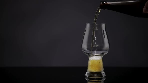 Beer Is Pouring Into Glass