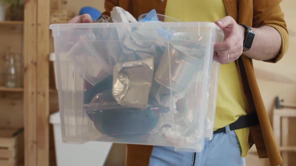 Unrecognizable Volunteer Working in Trash Sorting Center