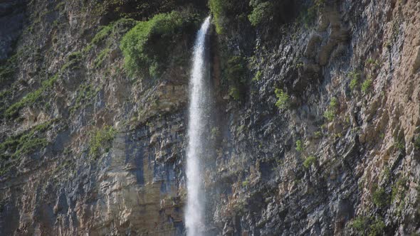 Waterfall falling down from the cliff