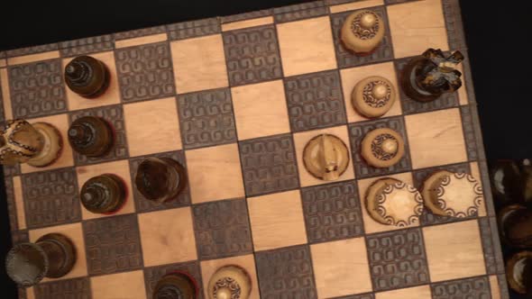 Chess matte scene seen from above with knocked puppets.