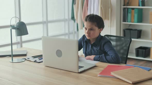 A Teenage Girl Studies at Home Online Does Homework Makes Notes Online School