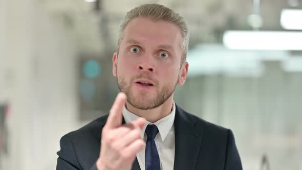 Portrait of Angry Businessman Arguing, Fighting 