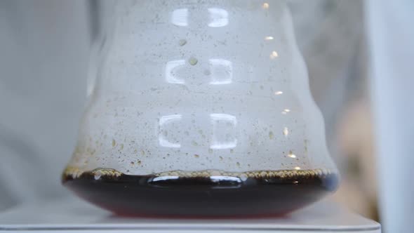 Close Up of Filter Coffee Maker Kettle with Thermometer and Digital Scale on Wooden Table