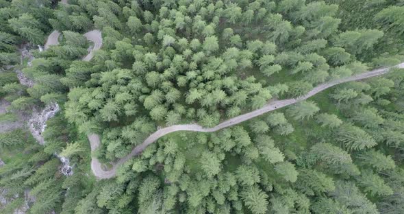 Aerial drone view of hikers hiking in the mountains.