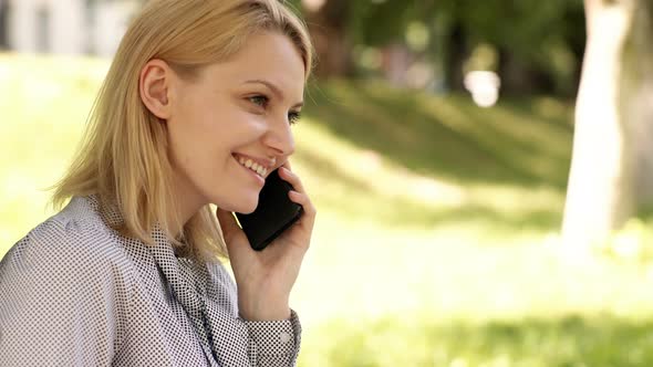 Woman Talking on Phone Outdoor