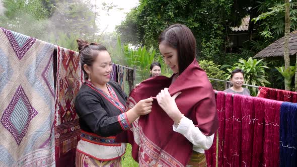 Asian Women Trying Traditional Laos Fabrics Patterns