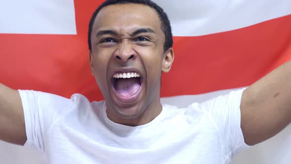 English Fan Celebrates Holding the Flag of England
