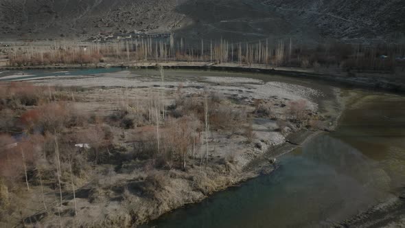 Aerial View Along Road Beside River In Ghizer Valley District In Pakistan. Dolly Forward