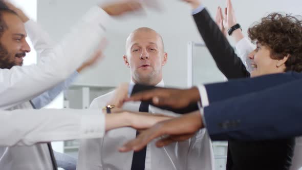 Businessman Playing Trusts Game with Colleagues