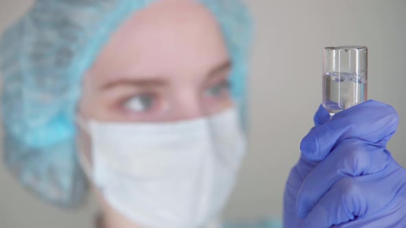  Nurse picks medicine into a syringe