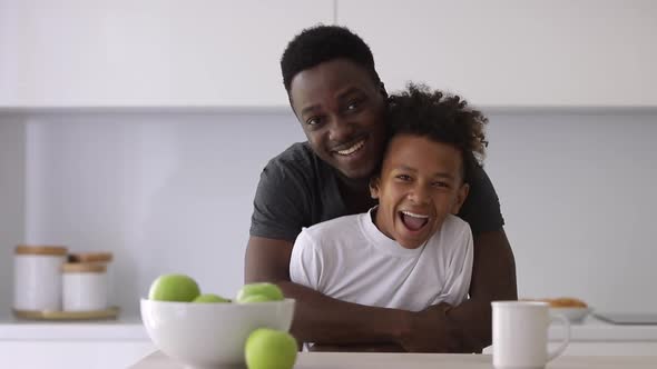 Portrait Father Hugging Mixed Son in Modern Kitchen Interior Spbi