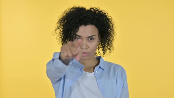 Portrait of Beautiful Casual African Woman Pointing at Camera