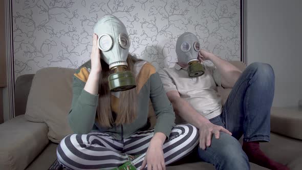 Daughter and Father in Gas Masks