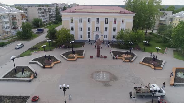 Aerial view of crowd of children are playing at Square near the house of Culture 17