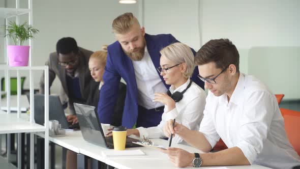 Business Team Coworking Brainstorming in the Office Focus on Concentrated Male