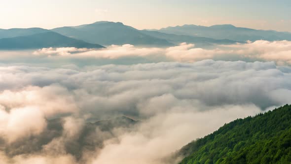 Low clouds and fast moving mists at sunrise