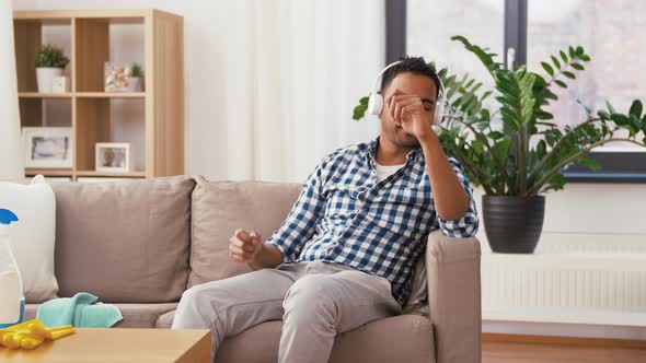 Indian Man in Headphones After Cleaning Home 91