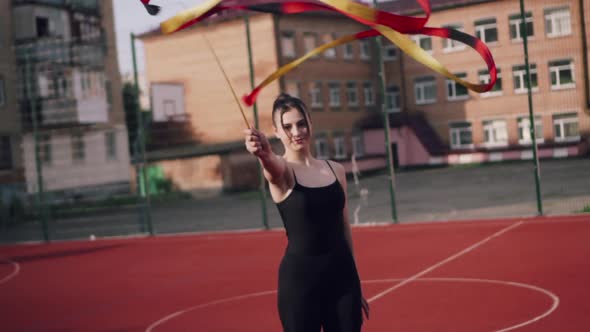 Young Woman Gymnast is Exercising