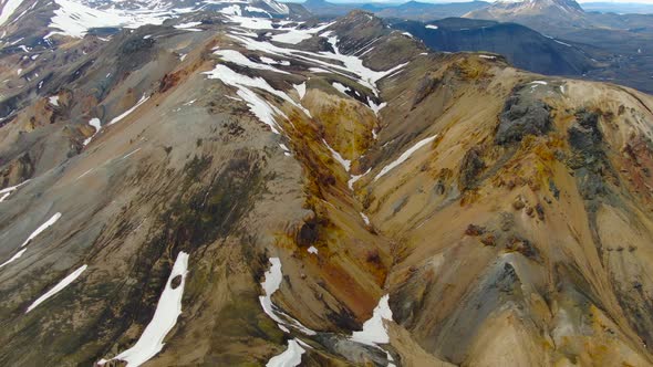 Flying over colorful volcanoes in Landmannalaugar region, interior of Iceland